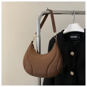 Brown French crescent hobo shoulder bag for women, trendy textured commuter underarm bag.