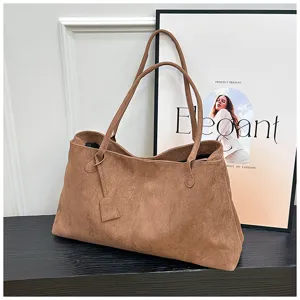 Brown suede tote bag detail view, showing spacious capacity and casual daily commuting style.