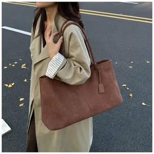 Brown suede tote bag for women, stylish and casual large capacity shoulder bag detail.