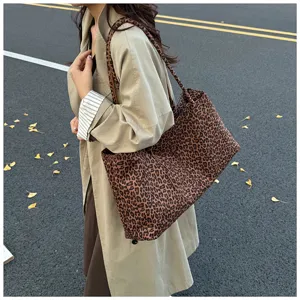 Detail view of a large capacity leopard print tote bag, stylish and casual shoulder bag.