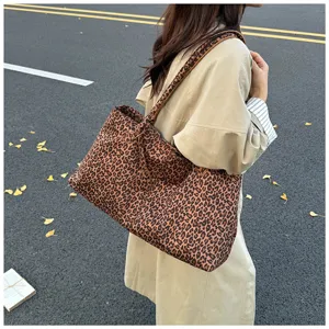 Detailed view of the stylish leopard print tote bag showcasing its large capacity and casual style.