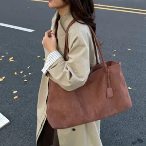 Detailed view of the large capacity brown suede shoulder tote bag, casual daily commuting style.