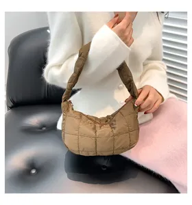 Brown quilted puffer shoulder bag, trendy cloud hobo design, soft padded texture for women.