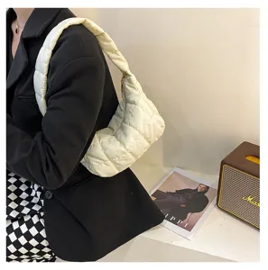 Quilted puffer shoulder bag, lightweight cloud hobo design, soft cream white winter handbag.