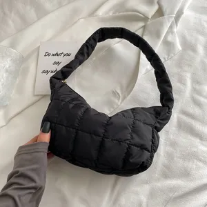 Black quilted puffer underarm bag, soft minimalist shoulder hobo handbag for women.