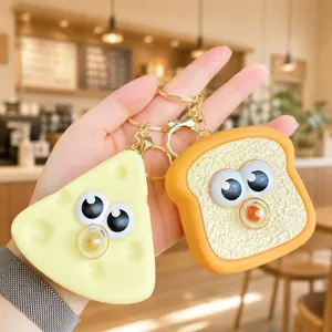 Cute silicone funny toast and cheese keychain with stress relief bubble squeeze feature.