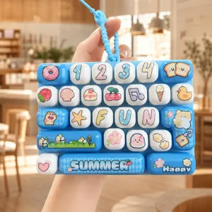 Cute decompression keyboard keychain, creative mini grid toy bag pendant for students.