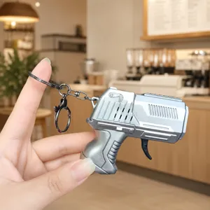 Mini flint pistol keychain, creative decompression toy metal gun key ring for daily use.