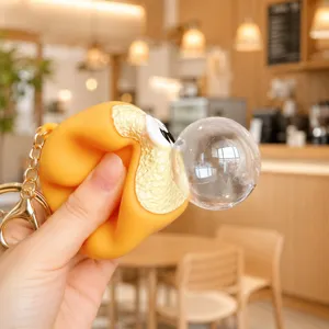 Close-up detail of cute silicone dessert squeeze bubble keychain, stress relief toy charm.