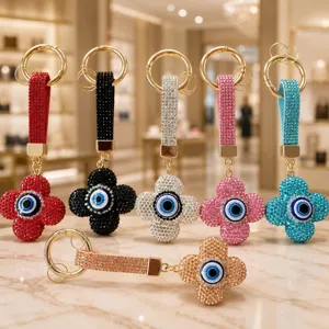 Porte-clés trèfle à quatre feuilles œil grec en cristal, charm de sac strass élégant.
