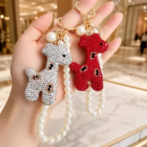 Exquisite rhinestone giraffe keychain detail, sparkling crystal and elegant pearl chain design.