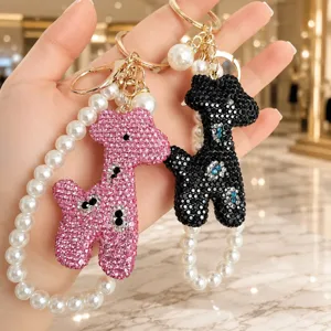 Rhinestone giraffe keychain with pearl chain, exquisite handmade bag charm and phone accessory.