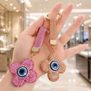 Porte-clés Créatif Trèfle à quatre feuilles Mauvais œil pour Femme Bijou de Sac en Alliage de Strass Luxueux Pendentif Clé Voiture
