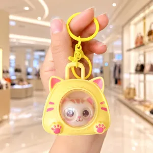 Cute Yellow Cat Face-Changing Keychain Stress Relief Cartoon Cute Bag Pendant Toy.