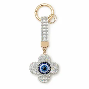 Porte-clés trèfle à quatre feuilles œil maléfique brillant, charm de sac strass luxe.