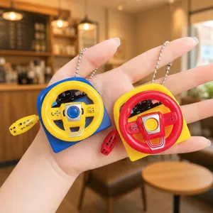 Mini simulation steering wheel keychain with sound effects and cute bead chain pendant.