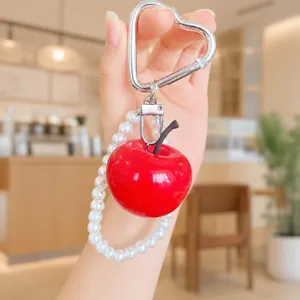Cute simulated red apple keychain detail, resin fruit pendant with pearl bracelet and heart hook.