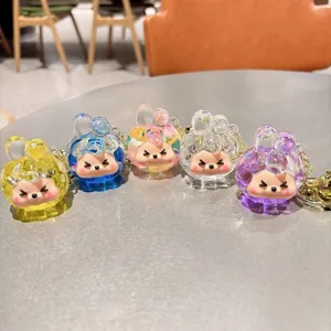 Cute acrylic liquid quicksand keychain with trendy cartoon character design, colorful bag pendant.