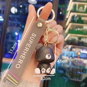 Cute resin bear keychain with strap for bags and keys, stylish cartoon couple accessory main view.