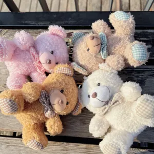 Cute fluffy teddy bear plush keychain with plaid bow, soft toy pendant for bags and keys.