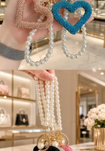 Korean style rhinestone hollow heart keychain and handmade pearl bag charm pendant.