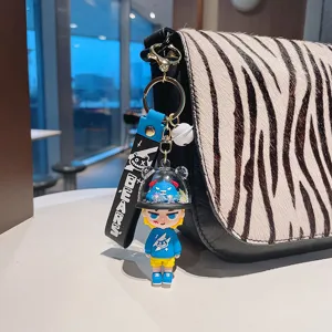 Cute PVC cartoon monster keychain bag charm with trendy strap design for stylish gifts