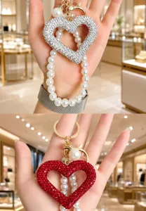 Korean style rhinestone hollow heart keychain and sparkling pearl delicate bag charm.