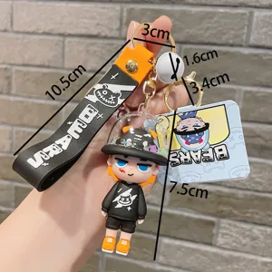 Trendy PVC monster boy keychain with strap and bell, perfect bag pendant and car keyring gift.