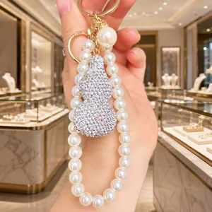 Elegante Perlen Strass Kürbis Schlüsselanhänger Handy Kette Luxus Tasche Schmuck Accessoire