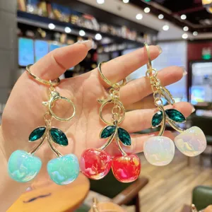 Colorful crystal cherry keychain, elegant bag pendant, stylish fruit charm for daily use.