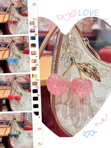 Sweet resin cherry bag charm pendant with cute glitter design, perfect for stylish purses.