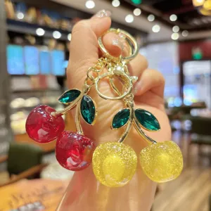 Glitter cherry bag charm keychain detail, stylish fruit pendant for women and girls gifts.