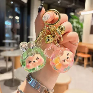 Cute quicksand acrylic keychain with liquid floating design, lovely cartoon rabbit pendant bag charm.