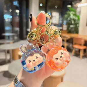 Cute liquid acrylic keychain with cute rabbit ears and sparkling glitter design for bags.