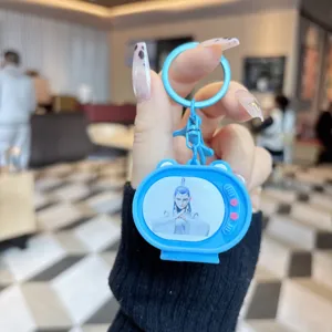 Cute Ne Zha 2 animated TV shaped flashing light keychain, creative bag pendant accessory.