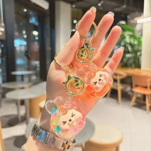 Cute liquid glitter acrylic keychain cartoon monster bag pendant charm for keys phone accessories