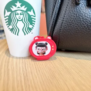 Cute Nezha flashing TV keychain charm, creative cartoon character bag pendant accessory.