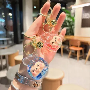 Cute acrylic quicksand keychain with liquid glitter, lovely cartoon design bag pendant for women.