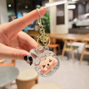 Cute liquid quicksand acrylic keychain with adorable cartoon character pendant, bag accessory.