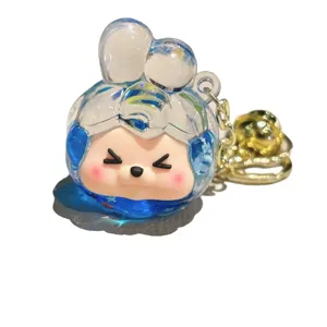 Cute liquid quicksand acrylic keychain charm with metal bell, bag pendant for daily use.