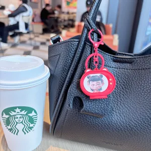 Cute cartoon TV shaped flashing keychain bag pendant accessory lifestyle detail view