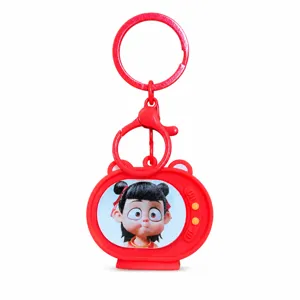 Creative TV Nezha keychain with flashing light, cute cartoon expression bag charm.