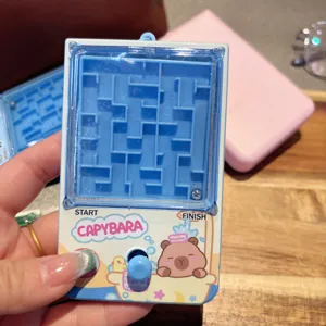 Close-up detail of the mini handheld capybara maze game keychain showing the clear blue maze path.