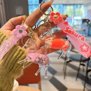Schöner Treibsand Pferd Schlüsselanhänger mit Sakura Band, klare Tier Taschenanhänger.