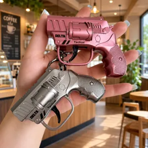 Creative mini metal pistol keychain, stylish tactical flint toy ring bag pendant for daily use.
