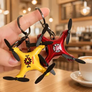 Miniature drone keychain detail, creative aircraft model pendant for car keys and kids gifts.