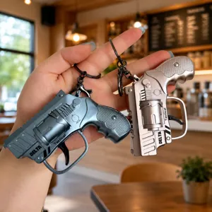 Mini flint pistol keychain, metal tactical revolver ring pendant for keys and bags.