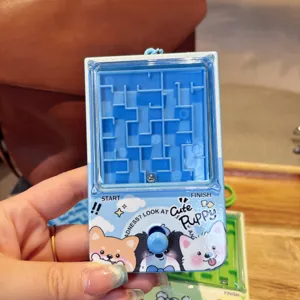 Mini portable plastic maze game keychain puzzle toy with cute puppy design for kids.