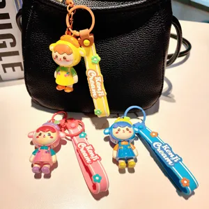 Cute cartoon girl doll keychain with colorful straps, perfect bag pendant and accessory.