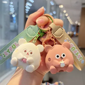 Detailed close-up of cute resin bubble tea mouse keychain with leather wrist strap.